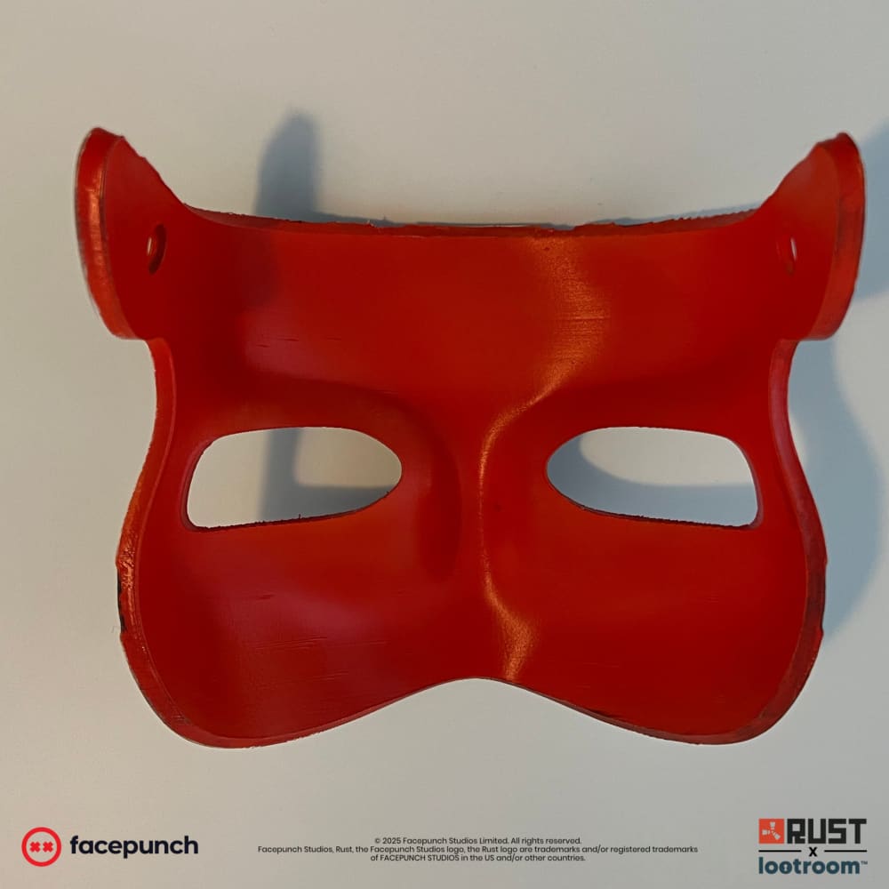 Rust Mendo kitsune facemask prop from behind, red inside with the two pre-drilled holes