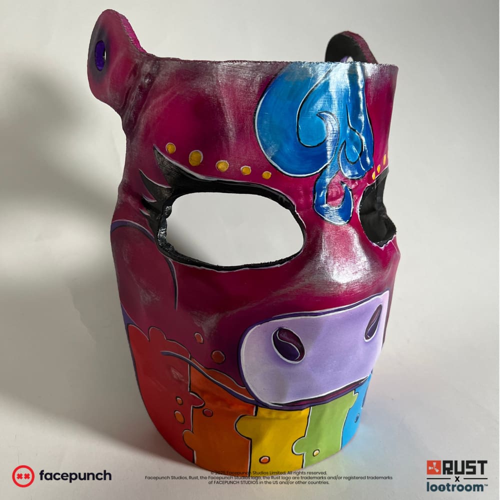 Rust Rainbow Pony facemask prop at an angle, showing one of the two pre-drilled holes