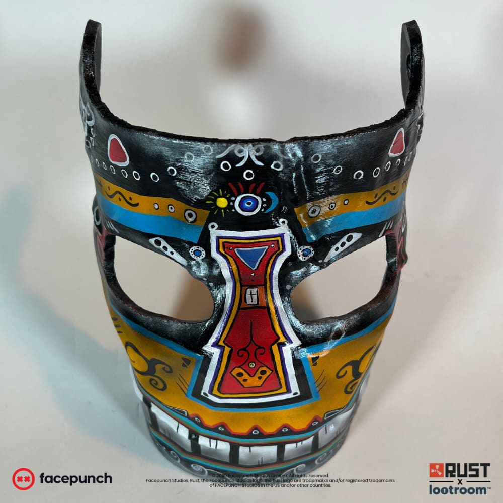 Rust Sunrise facemask prop, front view showing the small yellow sun above the eyes