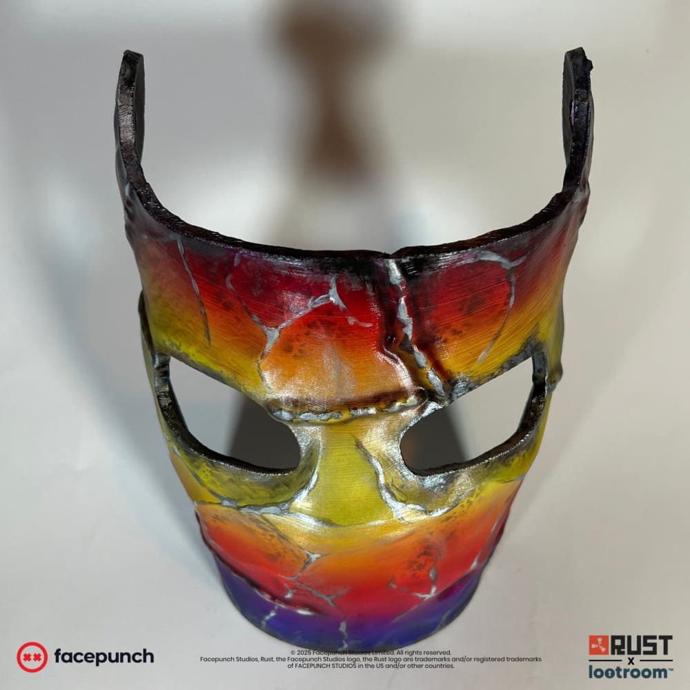Rust Tempered facemask prop, front view showing the violet-blue chin and the two eye openings