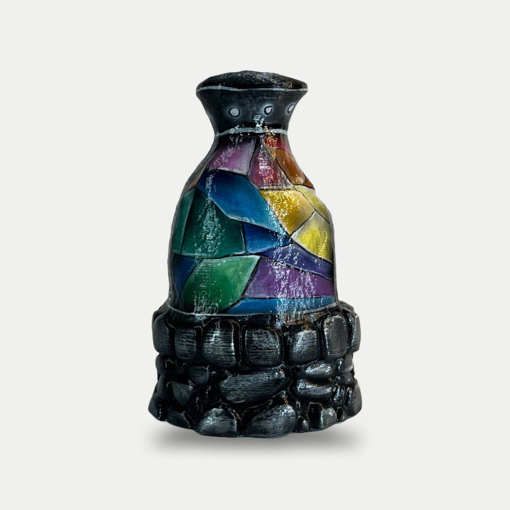 Rust Rustoria Furnace prop from the side, green, blue, violet and yellow facets over the stacked stone base