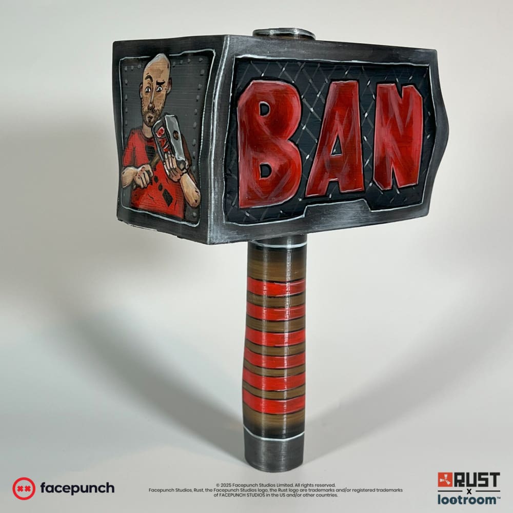 Rust Ban Hammer prop seen from the other angle, showing the red BAN lettering over the diamond-plate surface.