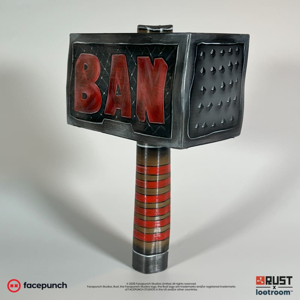 Rust Ban Hammer prop showing the pyramid spike face next to the BAN lettering, red-banded shaft below.