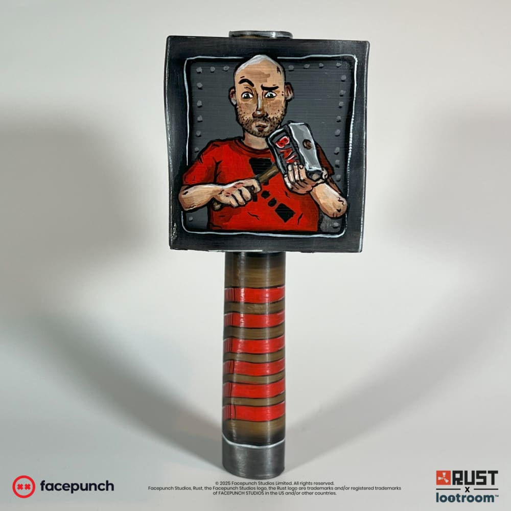 Front view of the Rust Ban Hammer prop with the hand-painted portrait of Camomo_10 holding a hammer.