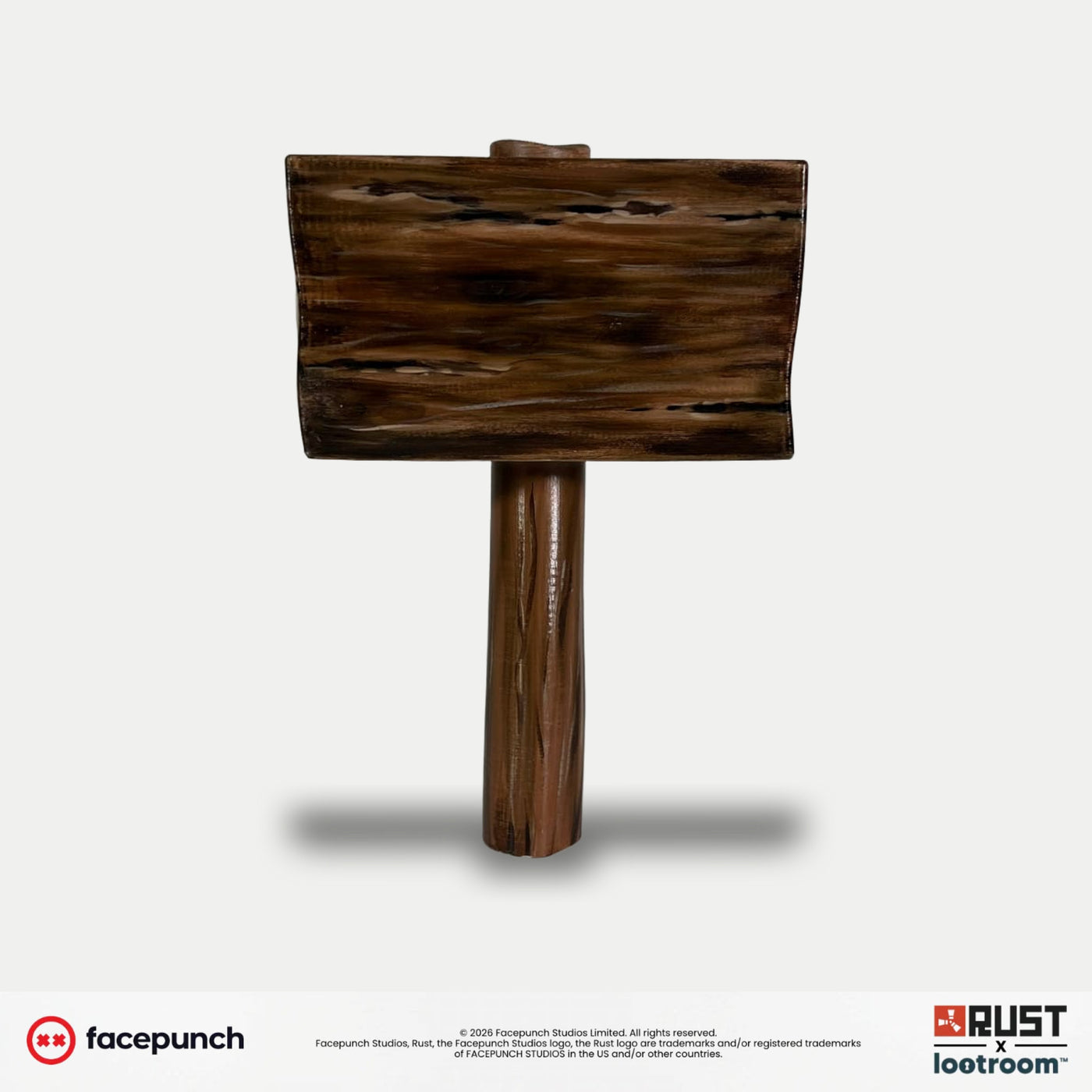 Front view of the Rust Default Hammer prop, the striking face with grain running across it