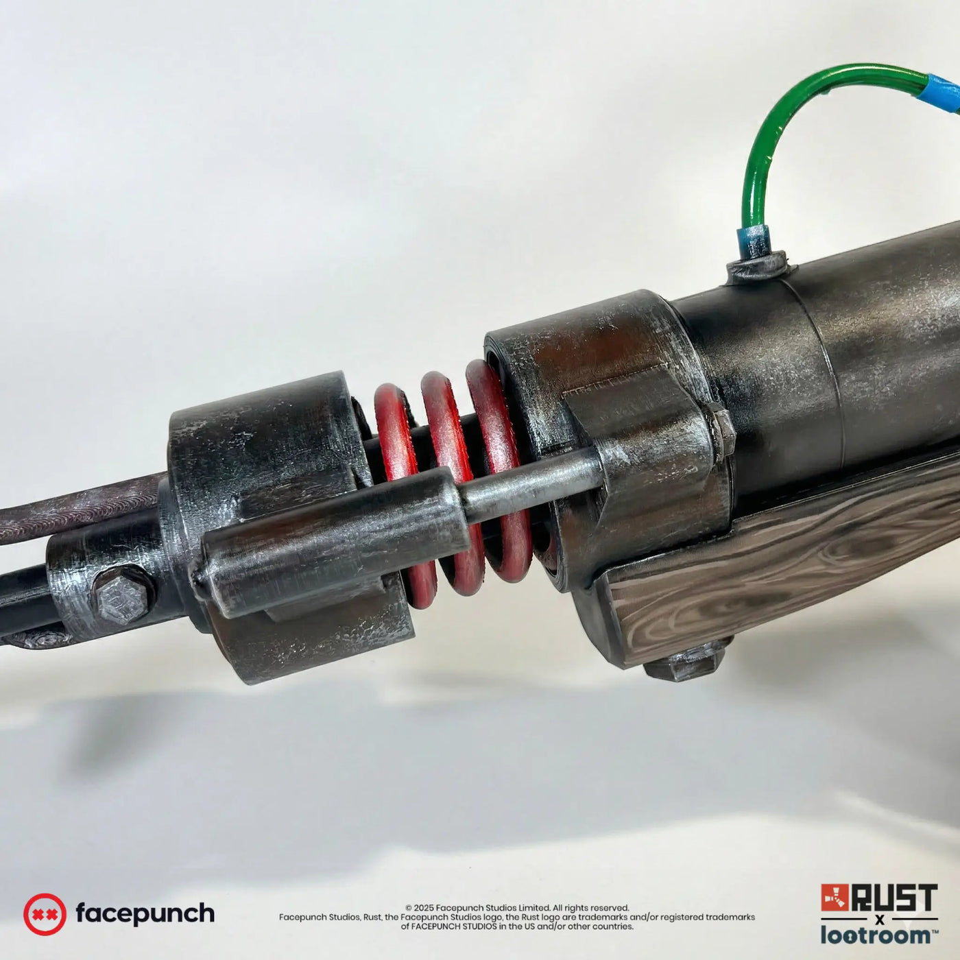 Close-up of the Rust Jackhammer piston with its red springs and the real hose running along the body