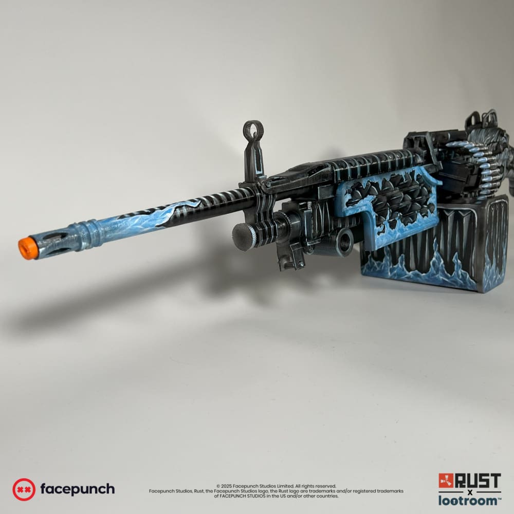 Rust Frost M249 LMG prop at an angle, showing the frozen barrel pattern and the ice-blue magazine box.