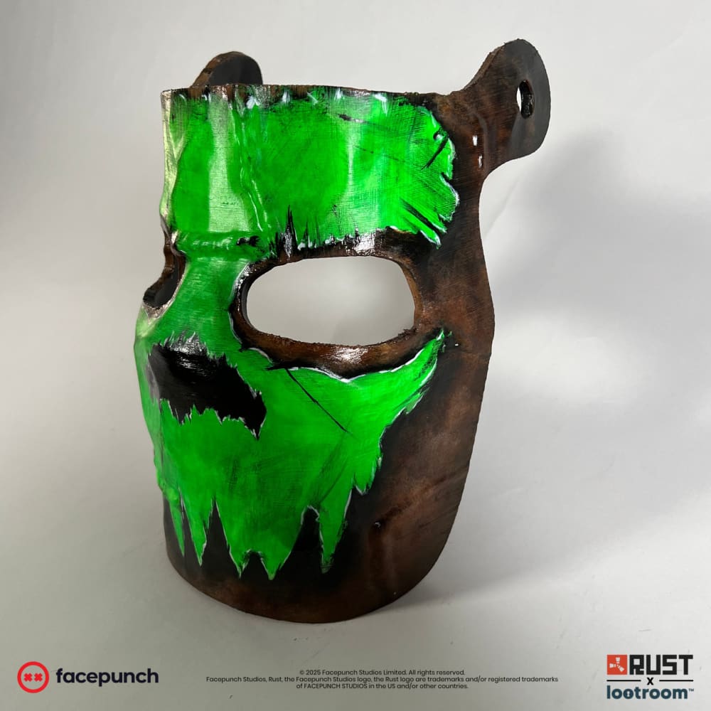 Rust Glowing Skull facemask from the side, showing the curve of the mask and one of the two pre-drilled holes for the strap