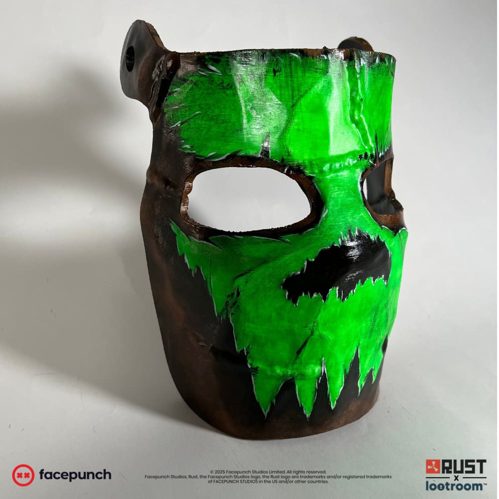 Rust Glowing Skull facemask at an angle, green skull wrapping around the rust-brown mask