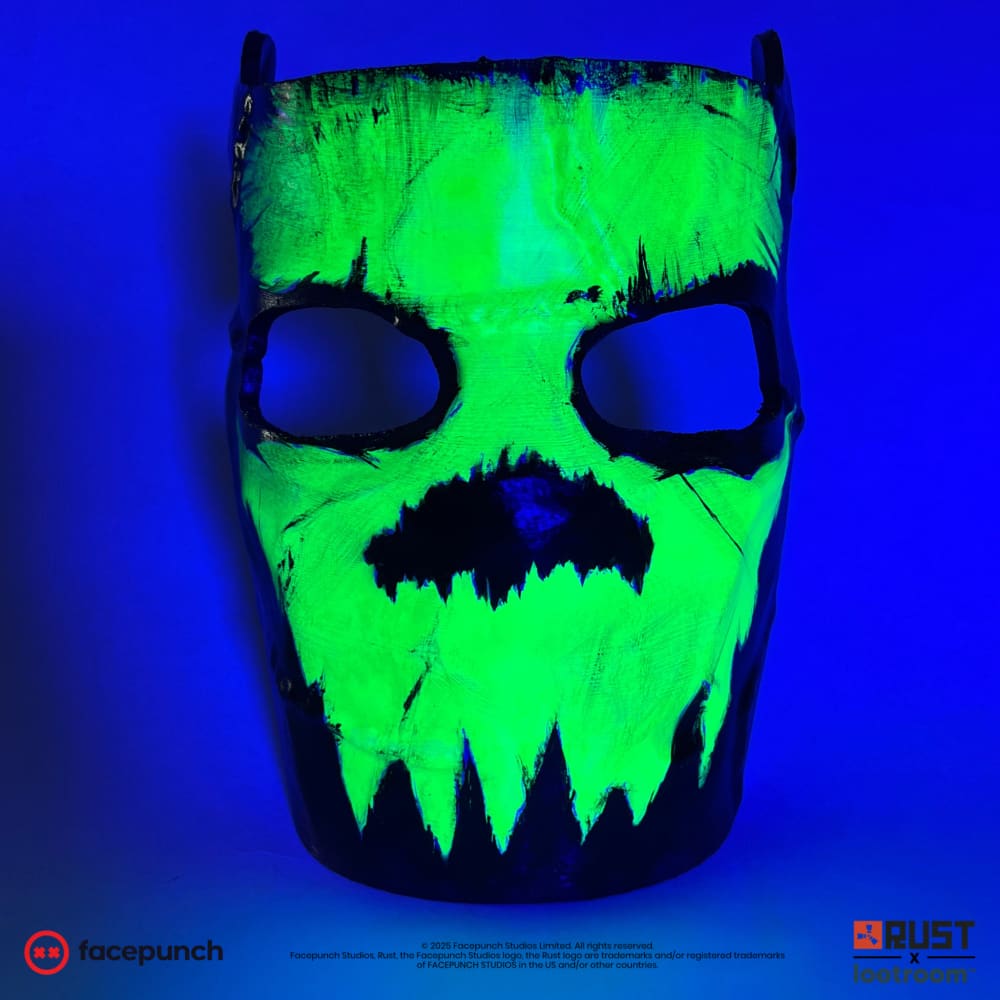 Rust Glowing Skull facemask under UV light, the green skull glowing while the mask goes dark
