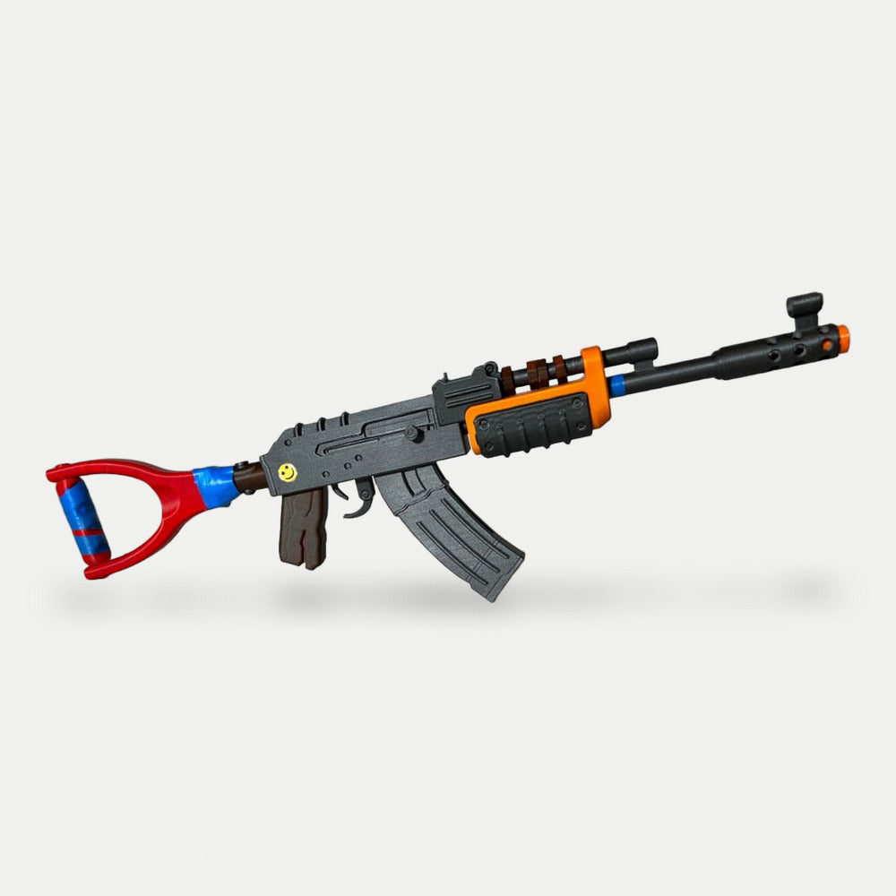 The Mini AK from the kit, 40cm miniature with grey receiver, red stock with blue tape and the yellow smiley sticker