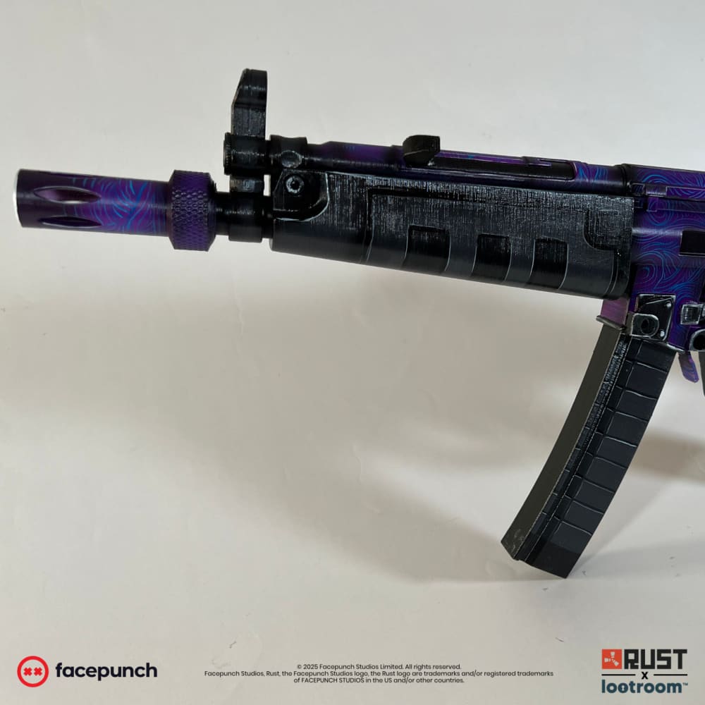 The front of the Rust MarkPlayz MP5 prop, cyan lines running through the purple beside the slotted black handguard.