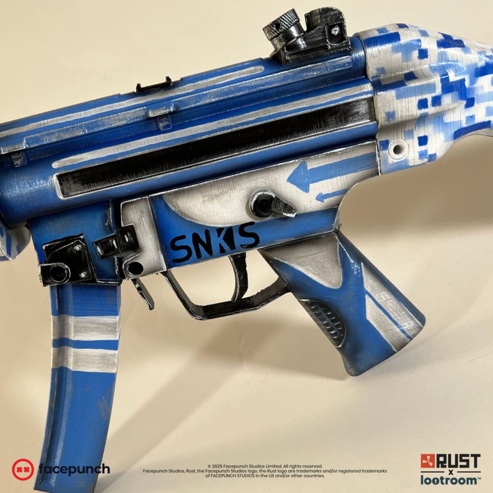 The Rust Sinks MP5 prop from the other side, SNKS lettered again above the blue and silver grip.