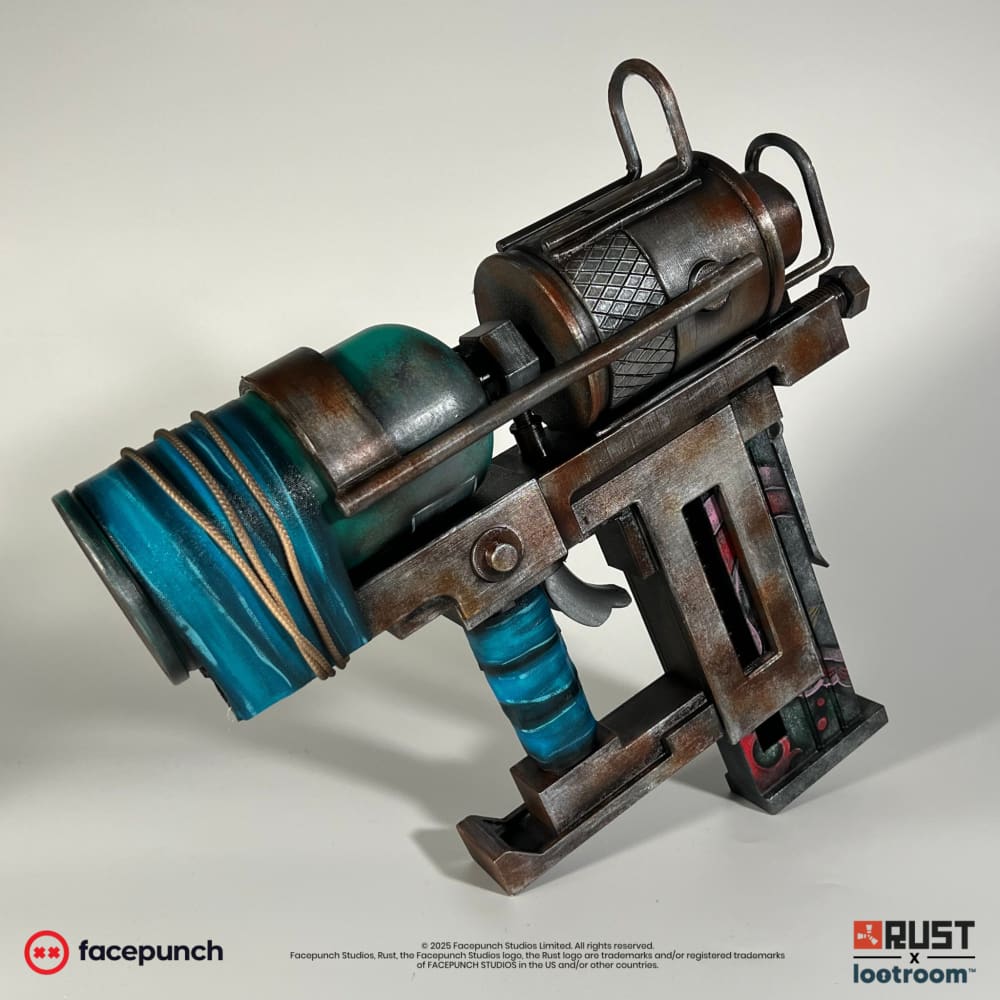 Rust Nailgun prop from the front left, the teal tank and blue-wrapped grip in focus.