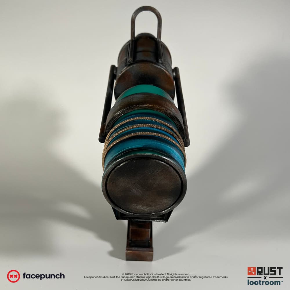 Head-on view down the Rust Nailgun's teal tank, showing the cream twine and blue tape wrap.