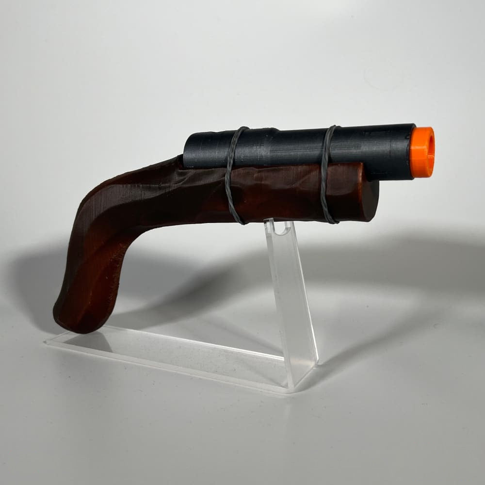 Clear acrylic pistol stand holding the Rust Eoka prop (Eoka sold separately)
