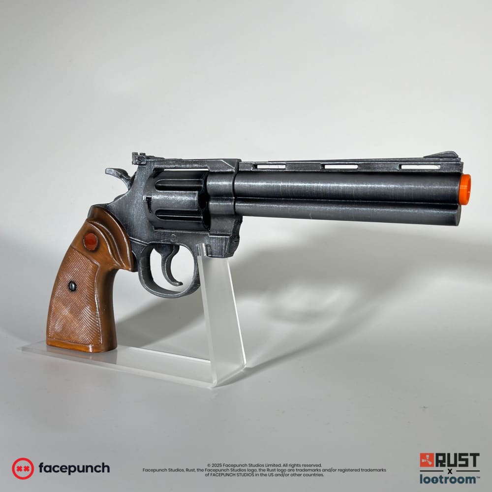 The hand-painted Python Revolver built from these STL files, 31cm assembled. The wood look on the grip is airbrushed PLA, and the acrylic stand is not part of the download.
