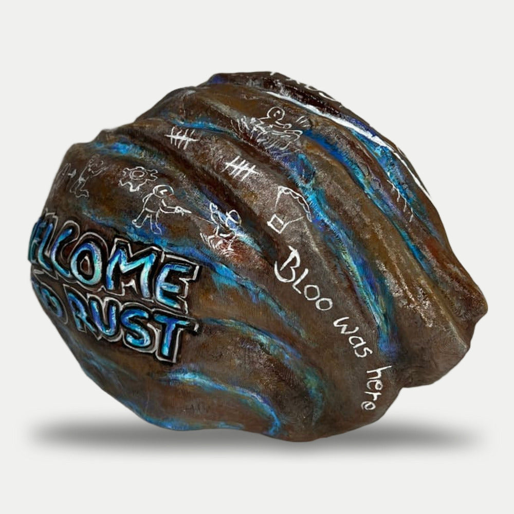 Blooprint Rock side view with white cave-style doodles and the Bloo was here signature