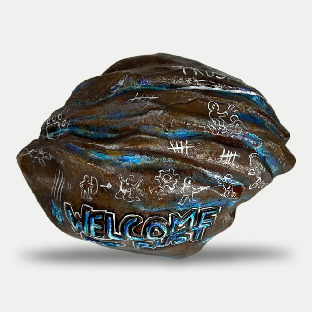 Blooprint Rock from above at an angle: brown stone with blue streaks, stick figures and tally marks