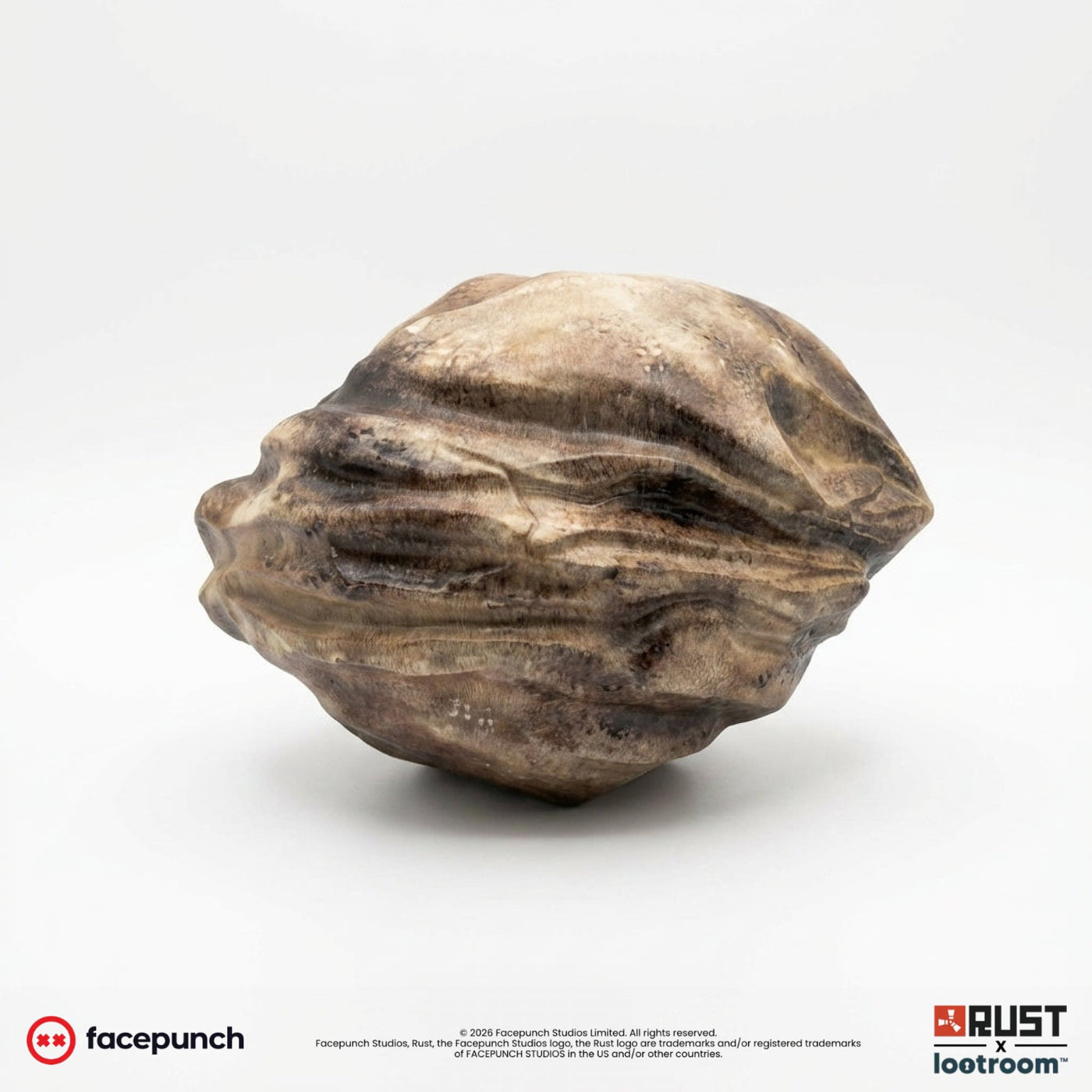 Rust Big Rock prop, sand-beige stone replica with dark brown grain, side view