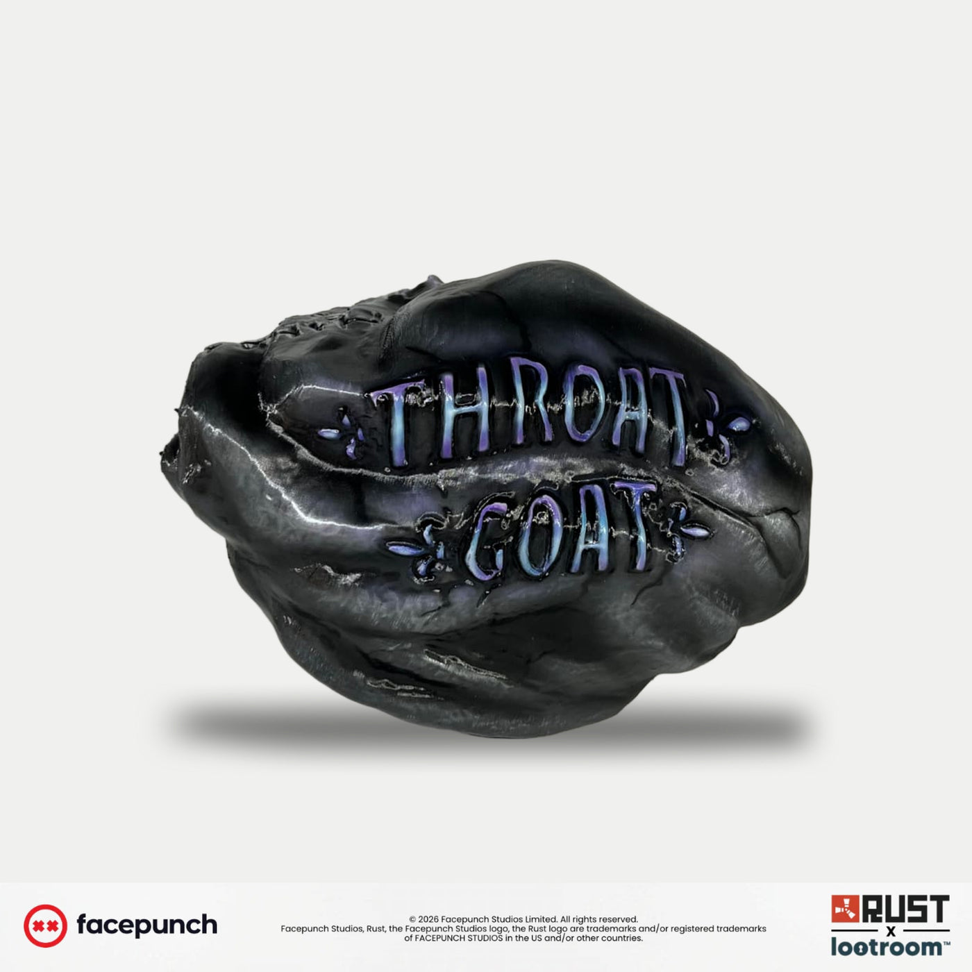 Reverse side of the Rust Throat Rock prop with THROAT GOAT carved in violet lettering