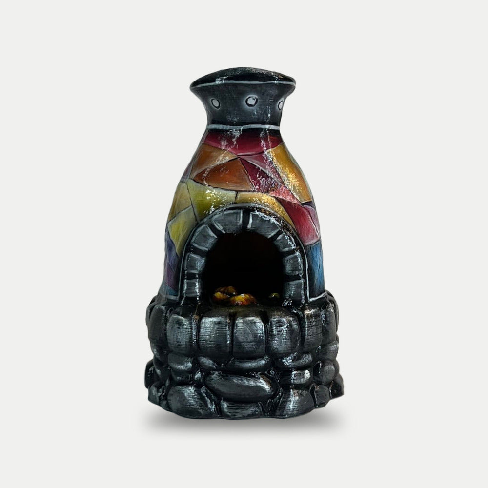 The Rustoria furnace from the kit, front view with the crystal-facet chimney and the stone base