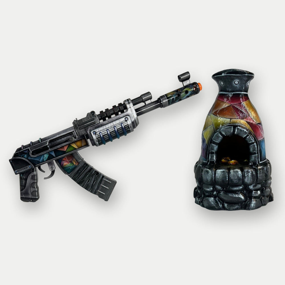 Rust Rustoria kit, the Rustoria AK with coloured crystal facets beside the Rustoria furnace with its stone base, both hand-painted props on a light studio ground