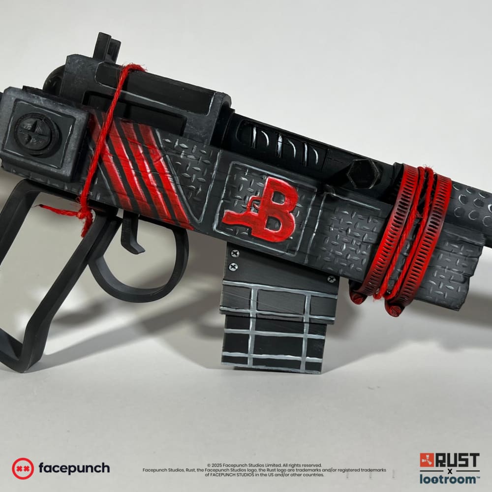The Rust bchillz SAR prop at an angle, showing the red B, the red diagonal stripes and the real red cords.
