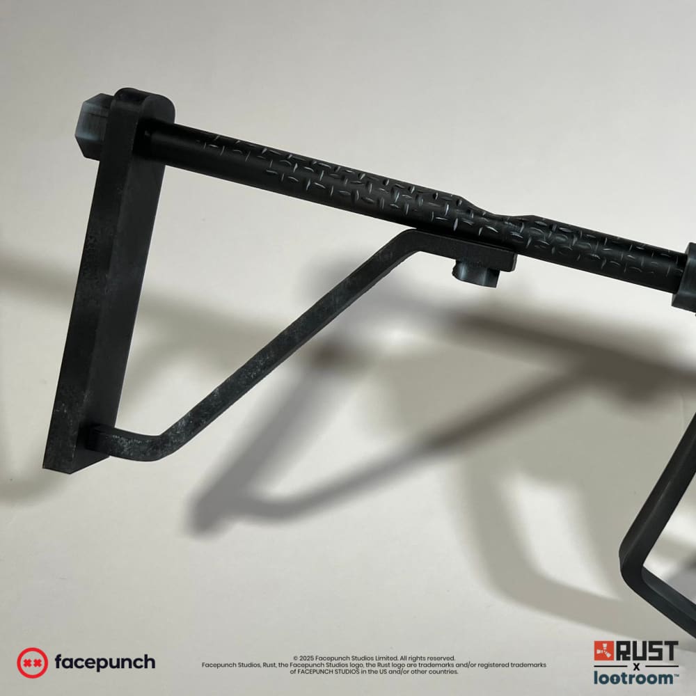 Close-up of the Rust bchillz SAR prop's stock, covered in the same diamond-plate texture as the body.