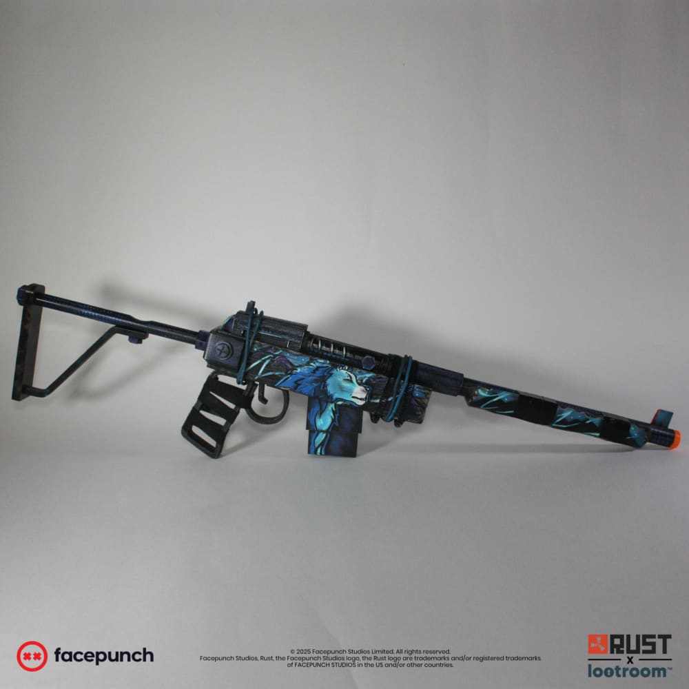 Rust Blooprint SAR prop from the side, the blue and cyan wolf running across receiver and magazine.
