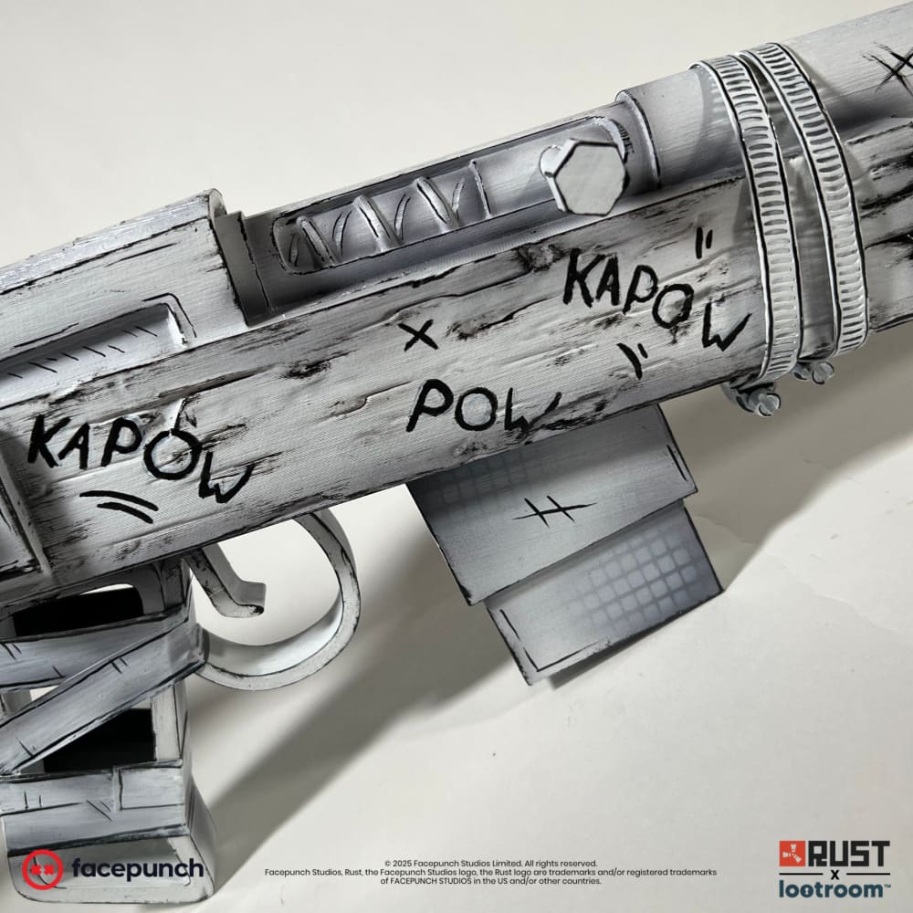 Close-up of the Rust Comics SAR prop's receiver, the KAPOW lettering and the halftone dot screen on the magazine.