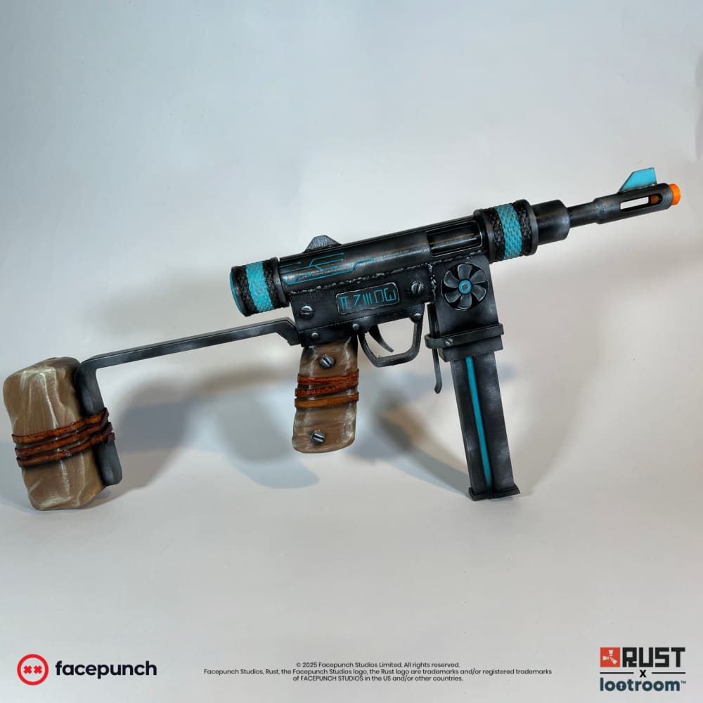 The Rust Alien Relic SMG prop from the other side, showing the turquoise line down the magazine and the shoulder rest.