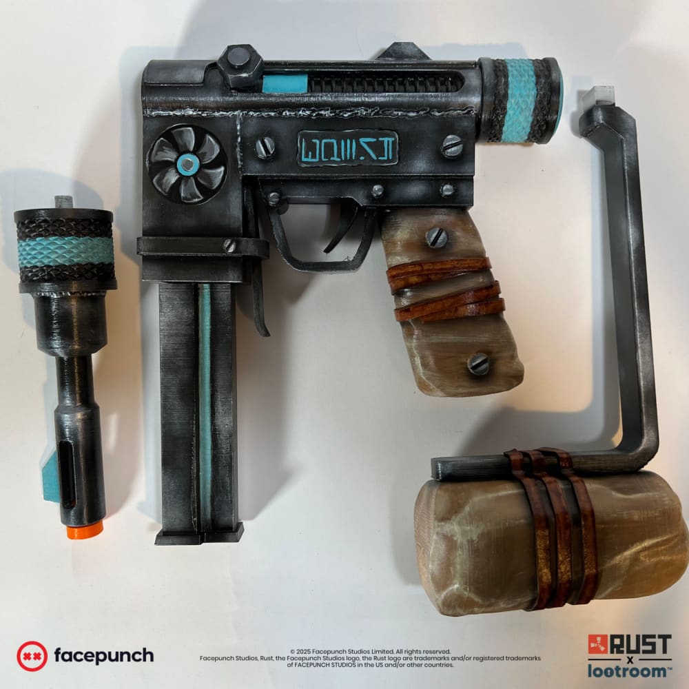 The Rust Alien Relic SMG prop taken apart into the parts it ships in: barrel, receiver and stock.