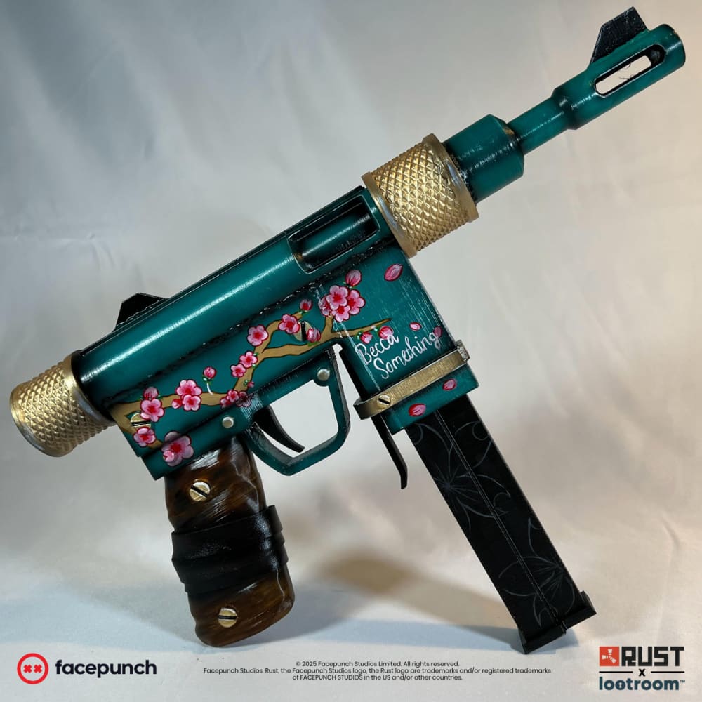 The Rust BeccaSomething SMG prop from the other side, showing the black magazine with its tone-on-tone scrollwork.