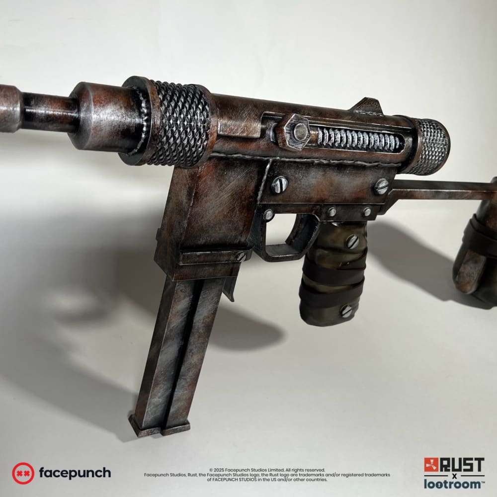 The Rust SMG prop at an angle, showing the knurled barrel sleeves and the painted weld seam along the receiver.