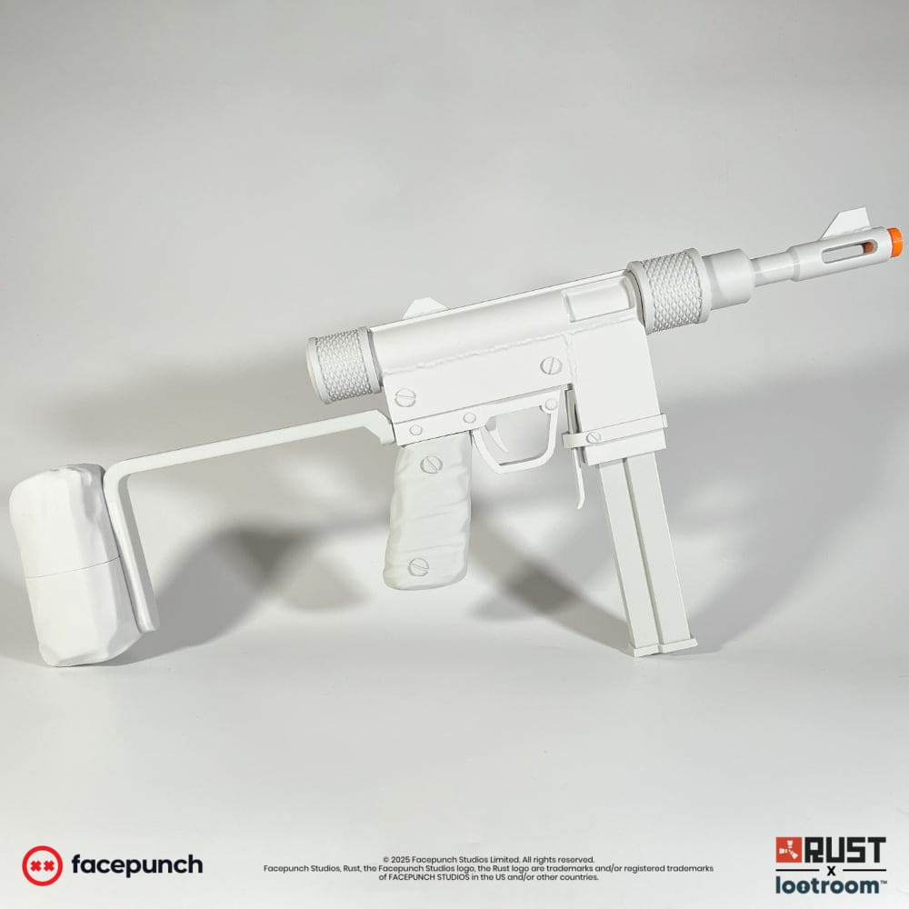The unpainted light grey Rust Custom SMG DIY prop from the other side, showing the magazine and the printed bands on the grip.