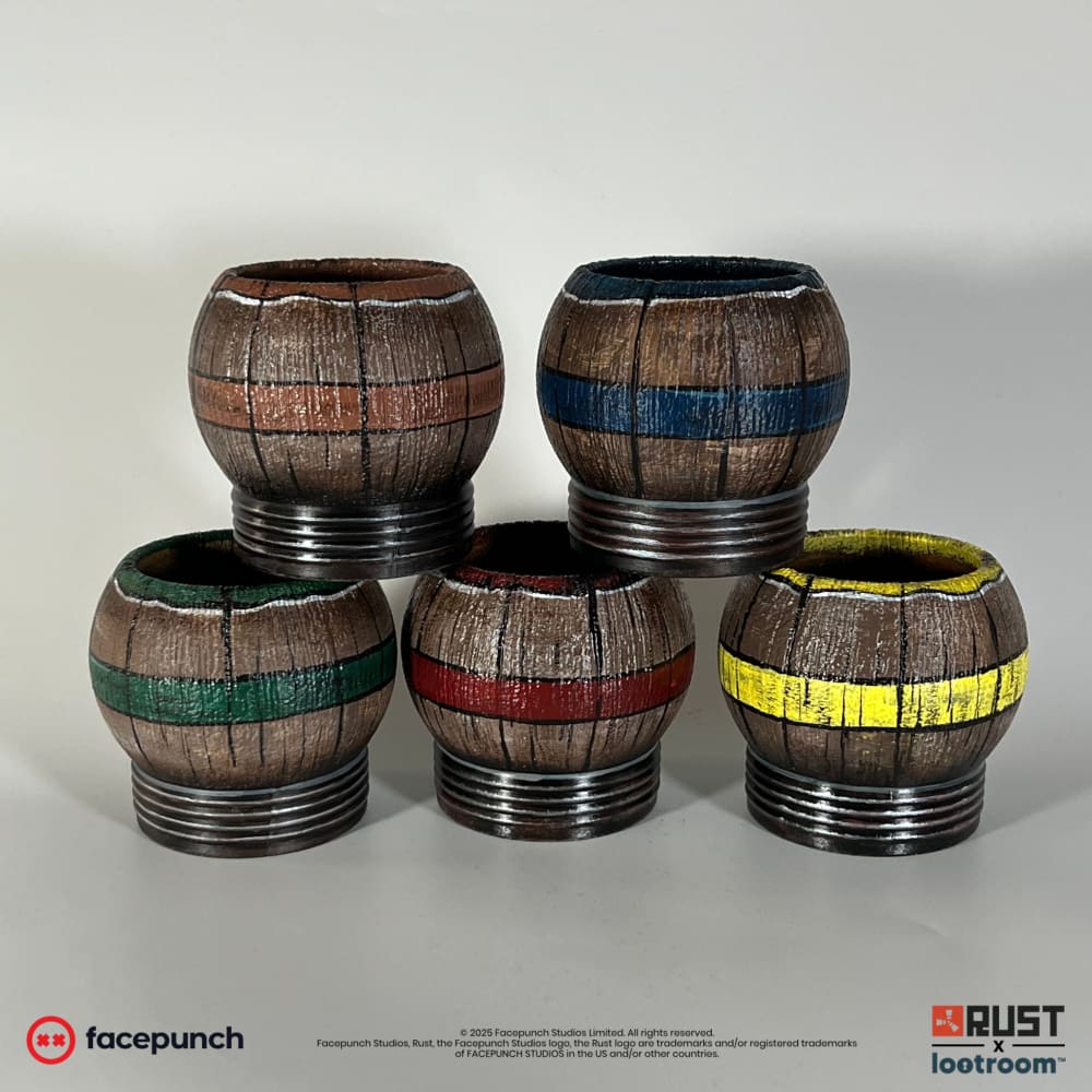 The five Rust Pure Tea props from behind, showing the coloured bands and rims