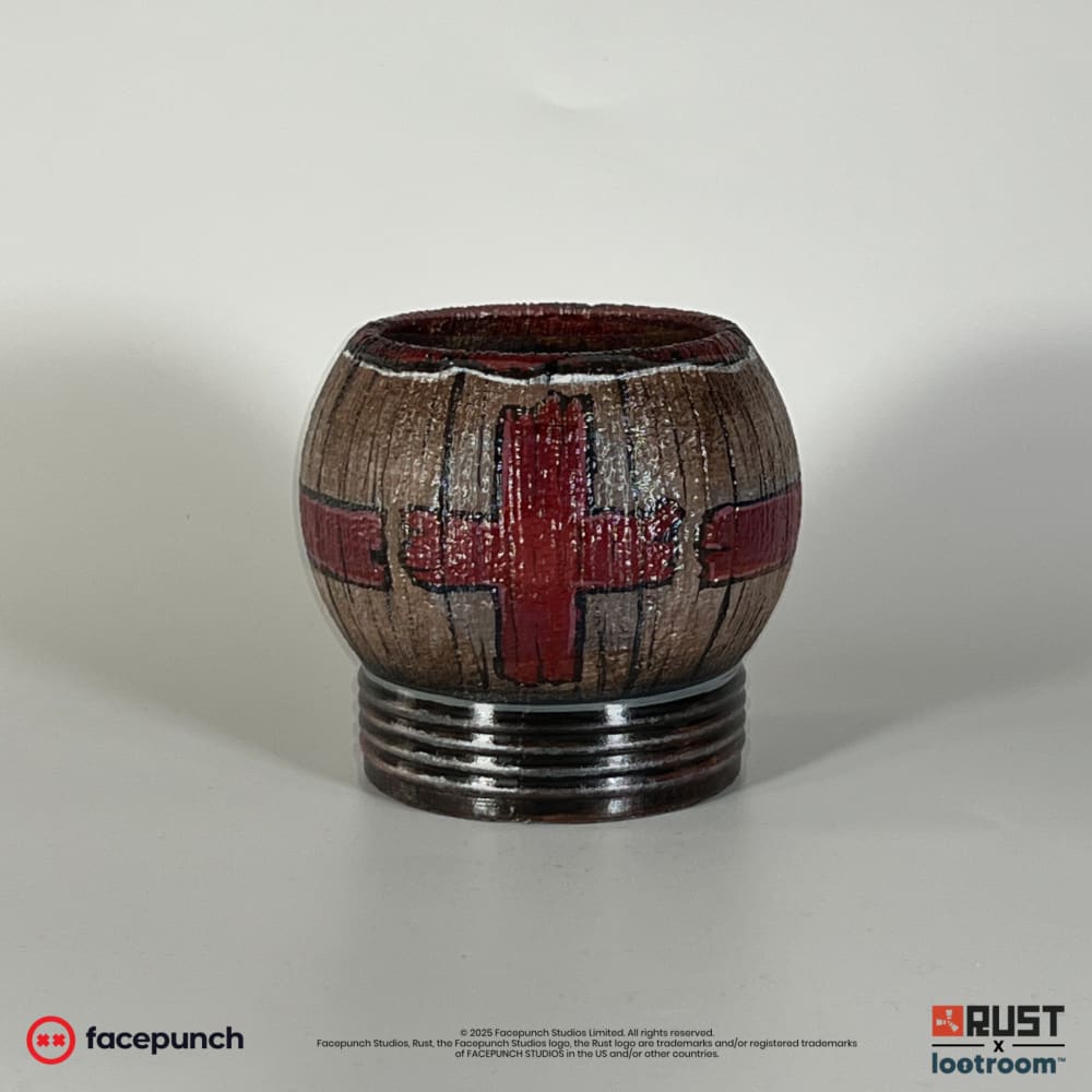 Rust Pure Max Health Tea prop, a wood-look cup with dark red crosses on a ribbed base