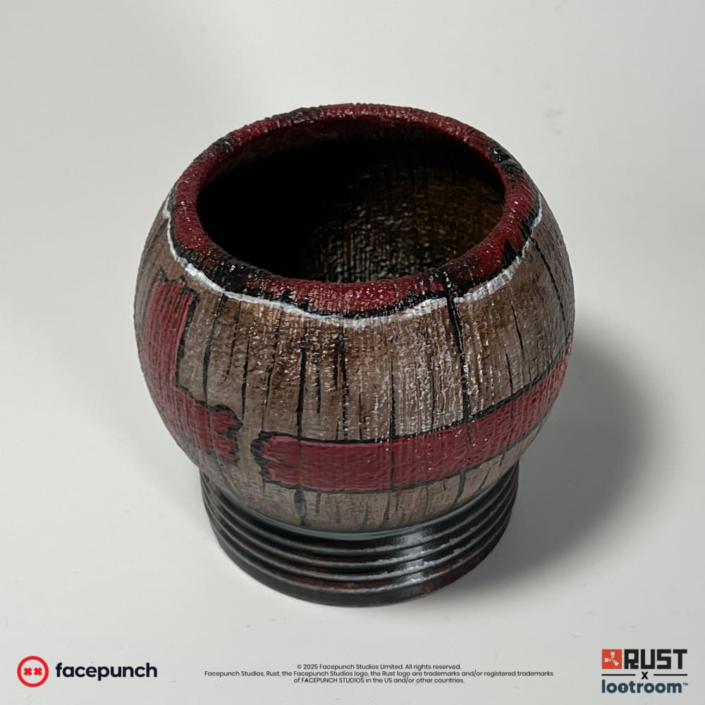 Rust Pure Max Health Tea prop from above, the open cup with its red-painted rim