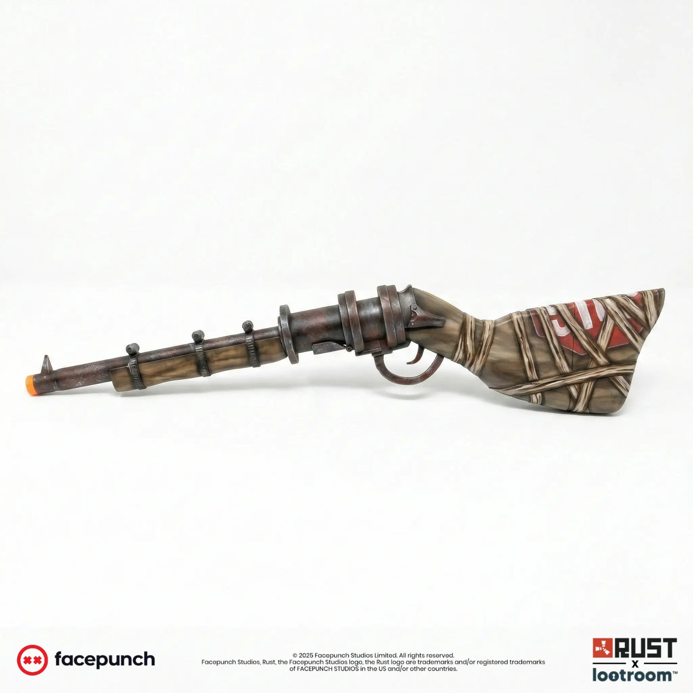 Rust Waterpipe Shotgun prop from the reverse side, with white lettering on the red plate showing through the wrapping.