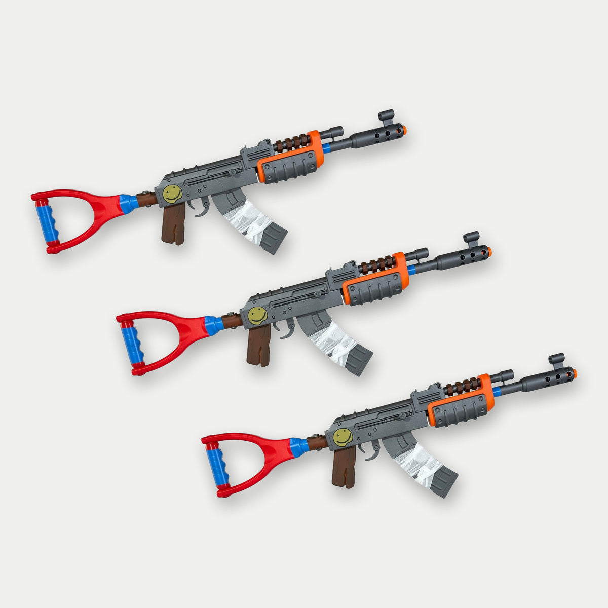 Rust Zerg kit, three Default-Skin AK props stepped side by side, 75cm lifesize each, on a light studio ground