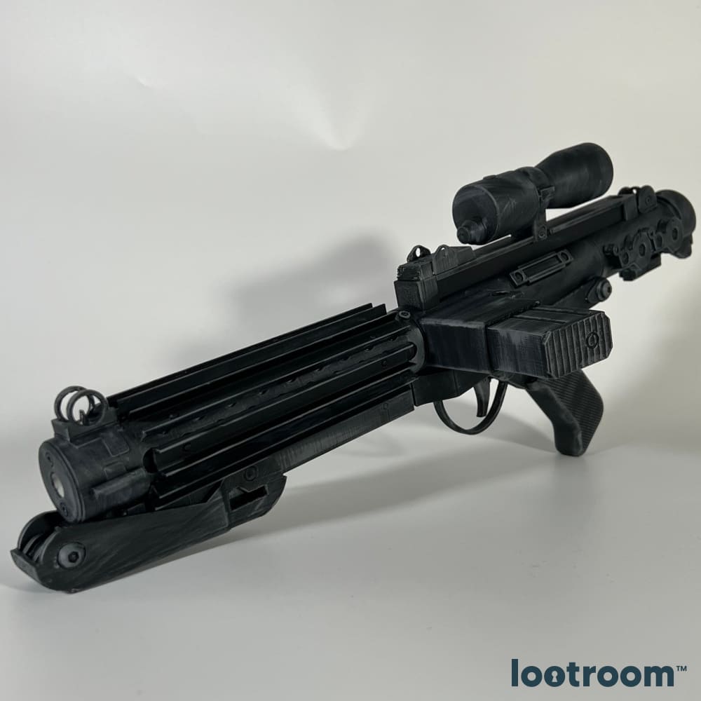 The printed E-11 at an angle, showing the scope and the cooling ribs along the barrel