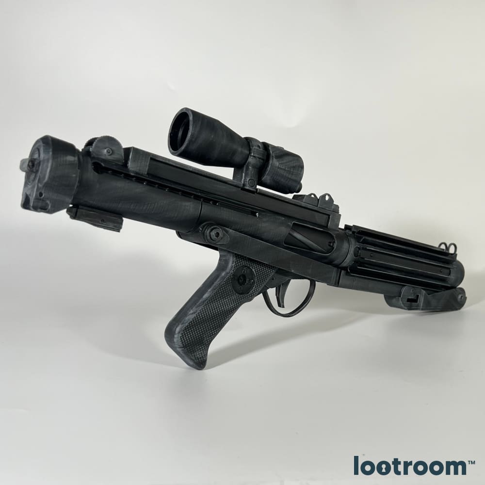 Star Wars E-11 blaster rifle prop at an angle, showing the scope on its rail and the checkered grip.